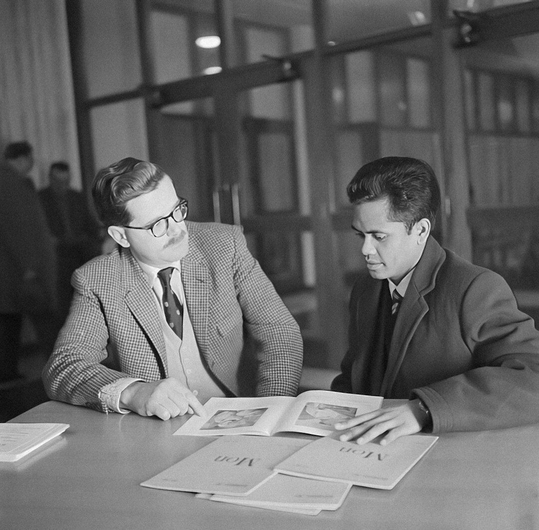 Two business consultants reviewing a strategy document together
