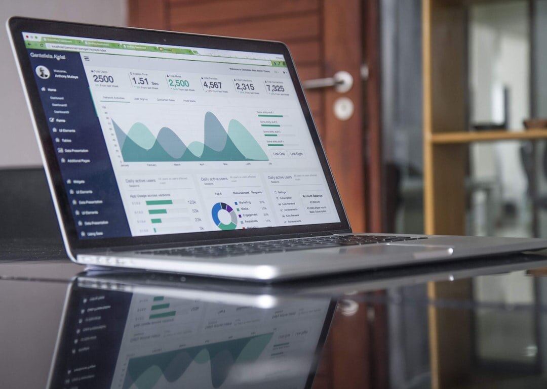 Laptop screen displaying upward business growth charts